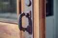 Detail of wooden door with old metal door handles Royalty Free Stock Photo