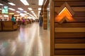 detail of wooden exit sign in a busy mall corridor Royalty Free Stock Photo