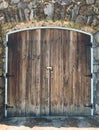 Detail, wooden garage door built into stone wall, Portland, Oregon