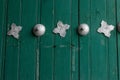 Detail of a wooden green antique door Royalty Free Stock Photo