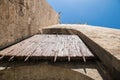 Detail of the wooden portal covered with iron plates to close the entrance to a castle Royalty Free Stock Photo