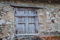 Detail of wooden window in a demolished stone house Royalty Free Stock Photo