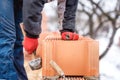 Detail of worker, bricklayer construction engineer fixing bricks and building walls at new house on a winter day Royalty Free Stock Photo