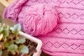 Detail of woven handicraft knit pink sweater