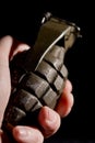 Detail of WW2 hand grenade against a black background. Royalty Free Stock Photo