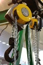 Detail of Yale Manual Chain Hoists with large black steel hook on chain end