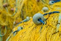 Detail of yellow nets on a boat deck Royalty Free Stock Photo