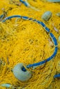 Detail of yellow nets on a boat deck Royalty Free Stock Photo