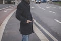 Detail of a young man posing in the city streets Royalty Free Stock Photo