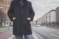 Detail of a young man posing in the city streets Royalty Free Stock Photo