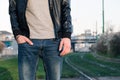 Detail of a young man posing in an urban context Royalty Free Stock Photo