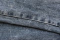 Detailed abstract texture of dark blue denim cloth. Background image of old used denim trousers fabric Royalty Free Stock Photo