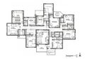 A detailed architectural floor plan depicts a multi-unit residential design. It features several Royalty Free Stock Photo