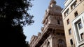 Detailed architectural old building in European city. Action. Beautiful old building made of red stone with many