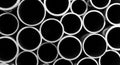 Close-up Macro View of a Stack of Metal Pipes in Black and White tubes industrial Royalty Free Stock Photo