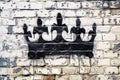 A detailed black and white drawing of a regal crown, grunge ink graffiti spray pattern splashes white background