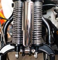 detailed chrome hydraulic shock absorber or rear suspension shock motorcycle custombike part Royalty Free Stock Photo