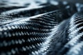 Detailed close-up of carbon fiber material with a focus on texture and light Royalty Free Stock Photo