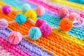 A detailed close-up of a crocheted blanket with intricate patterns, surrounded by a variety of colorful yarn balls in Royalty Free Stock Photo