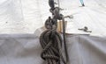 Detailed close up detail of ropes and cordage in the rigging of an old wooden vintage sailboat Royalty Free Stock Photo