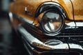 A detailed close-up of the front of a yellow car. This image can be used for automotive-related projects and