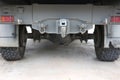Detailed close-up of large truck suspension, wheels and tires. Photo for background.
