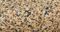 Close-up Macro Texture of Beige and Black Speckled Granite Stone rock Royalty Free Stock Photo