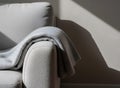 Neutral Sofa Arm With Cozy Grey Throw Blanket Royalty Free Stock Photo