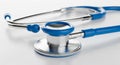 Close-up of Blue and Silver Stethoscope on White Surface medical healthcare Royalty Free Stock Photo