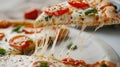 Close-up of a cheesy slice of pizza with tomato and basil on top Royalty Free Stock Photo