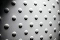 Macro close-up of small white polka dots on round shape, fantasy background with side light 8k