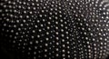 Detailed close-up of textured black fabric with tiny metallic-like dots, creating a unique pattern Royalty Free Stock Photo