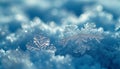 A detailed close-up of a unique snowflake crystal illuminated by soft blue light Royalty Free Stock Photo