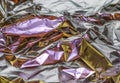 Detailed close up view on colorful lightened aluminum foil textures Royalty Free Stock Photo