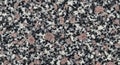 Close-up texture of speckled granite stone with pink and black grains rock background Royalty Free Stock Photo