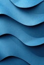 Detailed close-up view of a vibrant blue wave pattern on textured paper