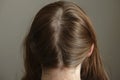 Detailed Close-Up of a Woman's Parted Brunette Hair