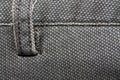 Detailed closeup of blank grungy denim. Vintage gray jeans with laces, good for background Royalty Free Stock Photo