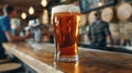 Detailed closeup of frothy beer glass with warm bokeh lights background, perfect for text placement Royalty Free Stock Photo