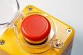 Detailed closeup view of a red emergency stop button industrial machine safety off switch, red yellow panic button with cover open Royalty Free Stock Photo