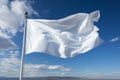 Detailed closeup of a white flag waving proudly on a flagpole Royalty Free Stock Photo