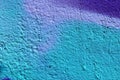 Detailed and colorful close up at cracked and peeling paint on concrete wall textures in high resolution Royalty Free Stock Photo
