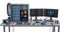 Computer Repair Setup with Tower PCs Monitors and Electronic Components on a Gray Table Against White Background Royalty Free Stock Photo