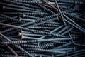 Detailed dark background and texture full frame of pile metal steel nails for construction of carpenter