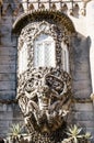 Detailed design and sculpture of a Newt above the entrance to the Pena National Palace of Sintra Royalty Free Stock Photo