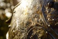 detailed etching on a metal greave in sunlight Royalty Free Stock Photo