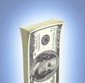 Detailed fluffy stack of money american hundred dollar bills isolated on blue gradient background 3d
