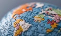 A detailed globe assembled from jigsaw pieces illustrates global connection and problem solving. Royalty Free Stock Photo