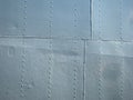 Detailed gray metal historic ship wall with seams and rivets Royalty Free Stock Photo