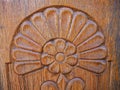 Detailed hand carved flower on traditional hungarian oak wood gate pylon . Royalty Free Stock Photo